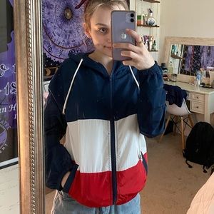 Rain jacket with a hood and pockets